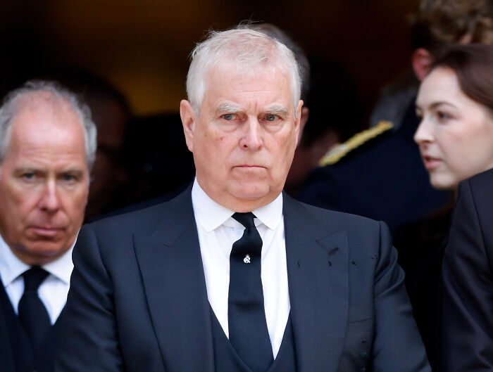 Former Prince Andrew in a black suit and tie attending an event amid U.S. Congress summons over Jeffrey Epstein links. Former Prince Andrew in a black suit and tie attending an event amid U.S. Congress summons over Jeffrey Epstein links.
