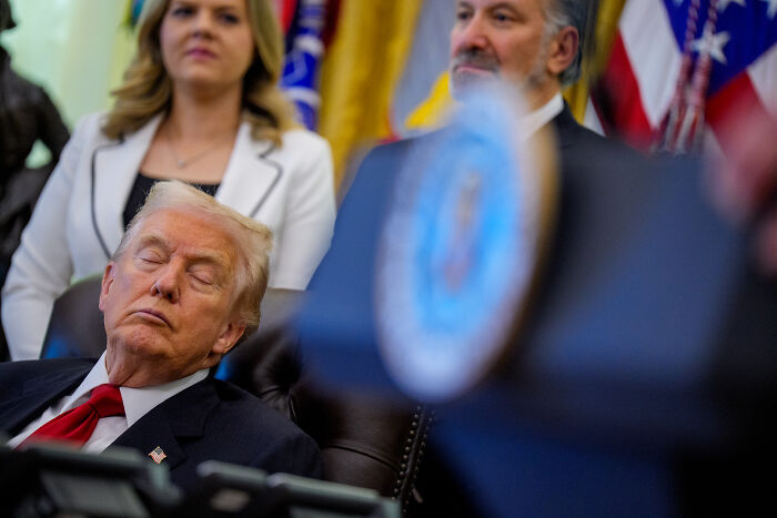 Former President Trump sitting with eyes closed during a formal event, with JD Vance mentioned in the background. Former President Trump sitting with eyes closed during a formal event, with JD Vance mentioned in the background.