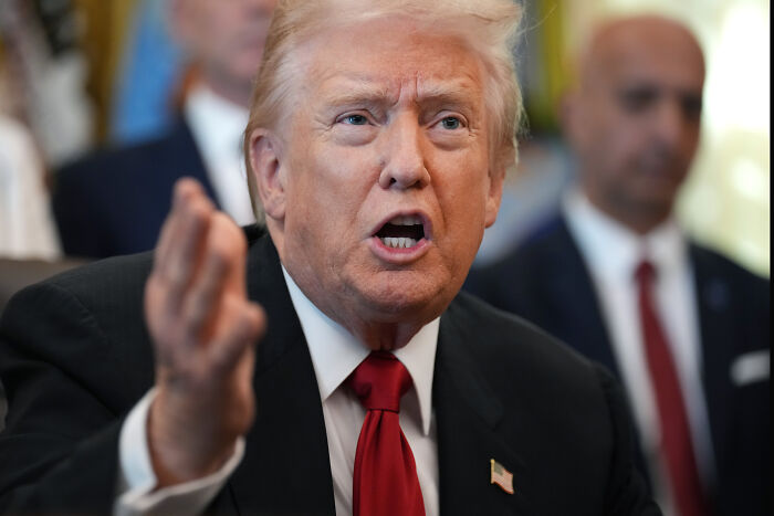 Donald Trump speaking emphatically during a tense exchange with reporters involving Afghan shooter coverage. Donald Trump speaking emphatically during a tense exchange with reporters involving Afghan shooter coverage.