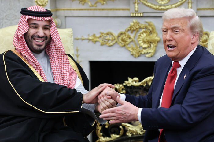 Saudi Crown Prince and Donald Trump shaking hands at White House in a moment hinting at Melania Trump’s subtle gesture during dinner.