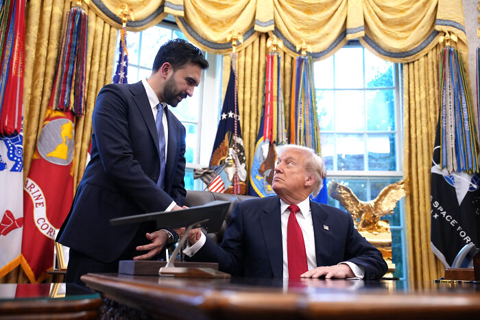 Zohran Mamdani in the Oval Office speaking with former President Donald Trump during a White House visit.
