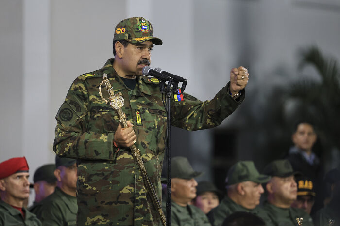 Venezuelan leader in military uniform speaking at microphone amid soldiers, related to White House Venezuela fentanyl supply crackdown. Venezuelan leader in military uniform speaking at microphone amid soldiers, related to White House Venezuela fentanyl supply crackdown.