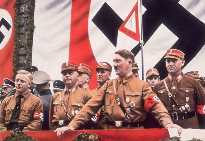 Adolf Hitler with N**i officers at a rally, related to DNA evidence suggesting a rare genetic disorder affecting manhood. Adolf Hitler with N**i officers at a rally, related to DNA evidence suggesting a rare genetic disorder affecting manhood.
