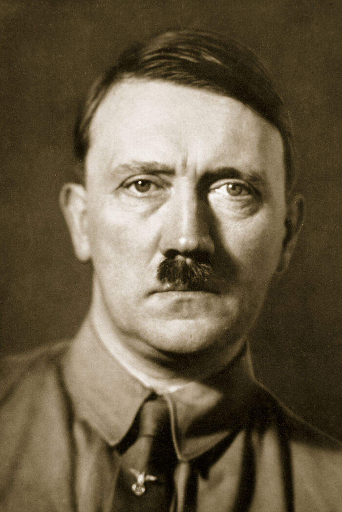 Sepia portrait of Hitler with focus on facial features linked to rare genetic disorder affecting manhood size. Sepia portrait of Hitler with focus on facial features linked to rare genetic disorder affecting manhood size.