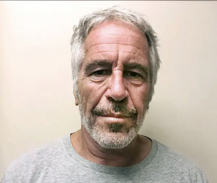 Man with gray hair and beard in a plain shirt, related to influential people appearing in Epstein emails content.