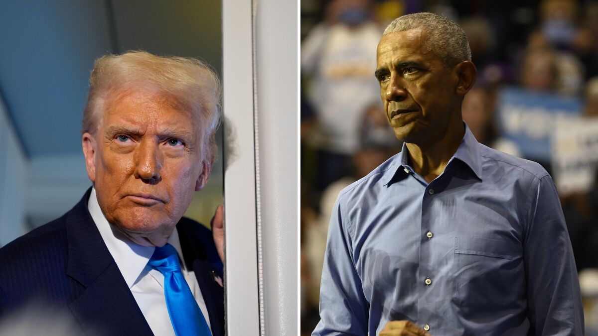 Donald Trump in a suit and blue tie alongside Barack Obama in a blue shirt during a public event indoors.