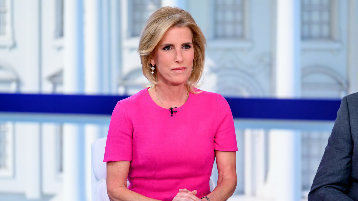 Fox host Laura Ingraham wearing pink, seated during tense on-air exchange from the White House studio backdrop