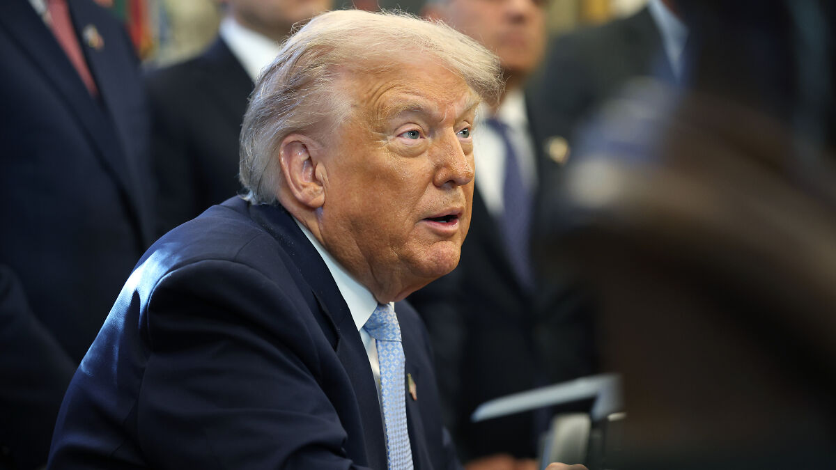 Former President Trump speaking at an event, with focus on the White House defense of his insult to a female reporter.