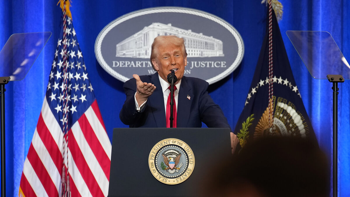 Former President speaking at DOJ podium with American flags, relating to Trump DOJ resignation letters archive.