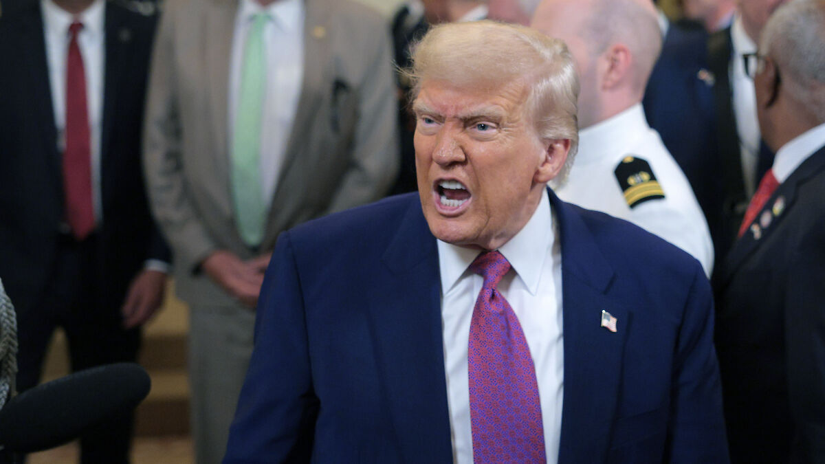 Former president speaking forcefully at an event with officials, related to Venezuela fentanyl supply issues.