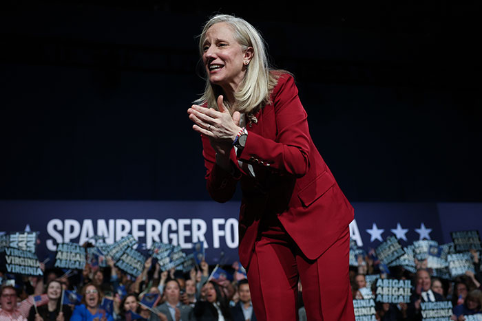 Female politician in red suit celebrates as Virginia turns blue delivering a heavy blow to Trump in a sweeping victory event Female politician in red suit celebrates as Virginia turns blue delivering a heavy blow to Trump in a sweeping victory event