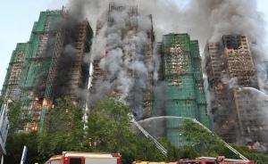Fatalities From Hong Kong Apartment Complex Fire Rise To 128, Officials Say