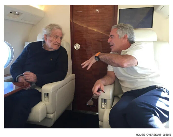 Two men in casual attire engaged in a serious conversation inside a private jet, related to Epstein files prosecution.
