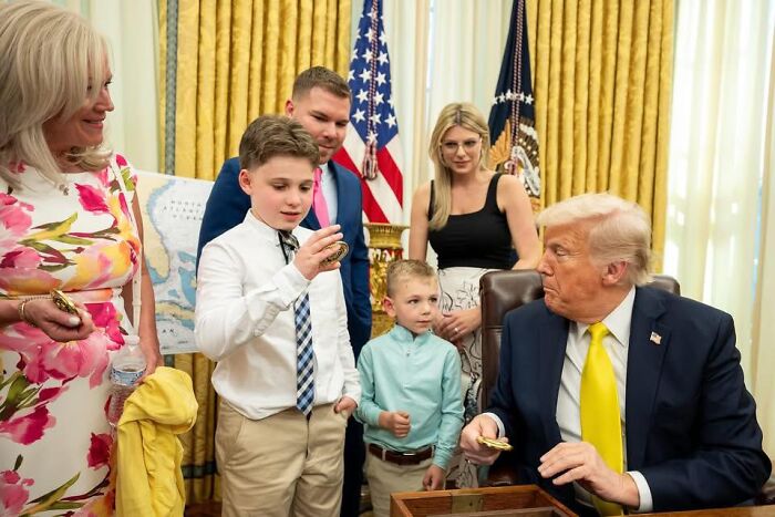 A family meets in the Oval Office with the former president amid discussions involving Karoline Leavitt’s detained family member.