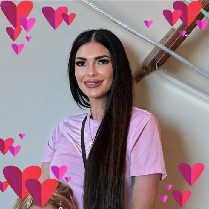 Mom with twin 6-year-olds posing indoors surrounded by pink and red heart graphics amid mansion tragedy and divorce. Mom with twin 6-year-olds posing indoors surrounded by pink and red heart graphics amid mansion tragedy and divorce.