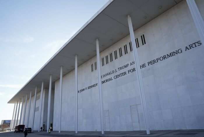 Exterior of the John F. Kennedy and Donald J. Trump Memorial Center building under a clear sky, related to new battleships.