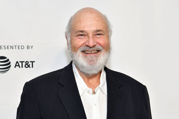 Rob Reiner smiling at an event, wearing a black blazer and white shirt, known for championing progressive causes. Rob Reiner smiling at an event, wearing a black blazer and white shirt, known for championing progressive causes.