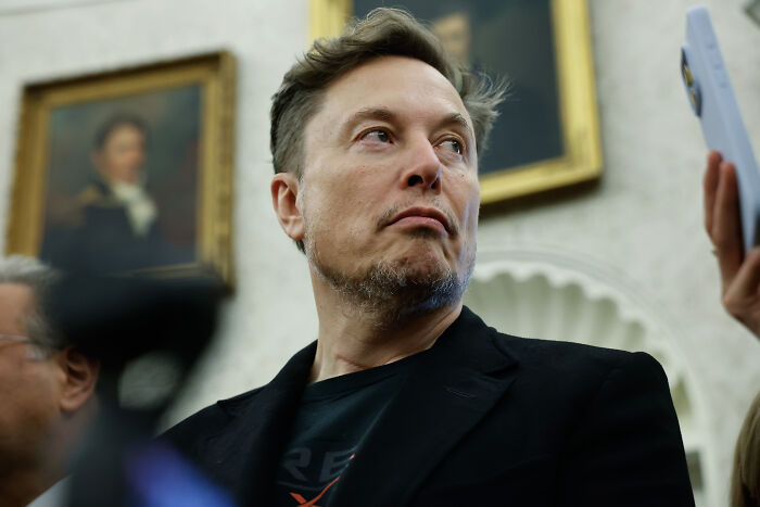 Elon Musk captured at an event with serious expression, highlighting Stephen Miller’s wife working for Elon Musk. Elon Musk captured at an event with serious expression, highlighting Stephen Miller’s wife working for Elon Musk.