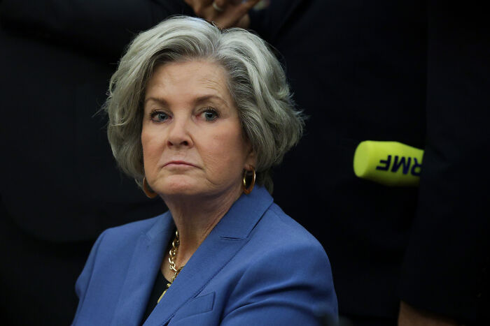 Woman with gray hair wearing a blue blazer at a formal event, related to Trump’s chief of staff and alcoholic personality discussions. Woman with gray hair wearing a blue blazer at a formal event, related to Trump’s chief of staff and alcoholic personality discussions.
