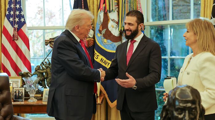 Donald Trump shaking hands with a world leader in the Oval Office during his first year back in power. Donald Trump shaking hands with a world leader in the Oval Office during his first year back in power.