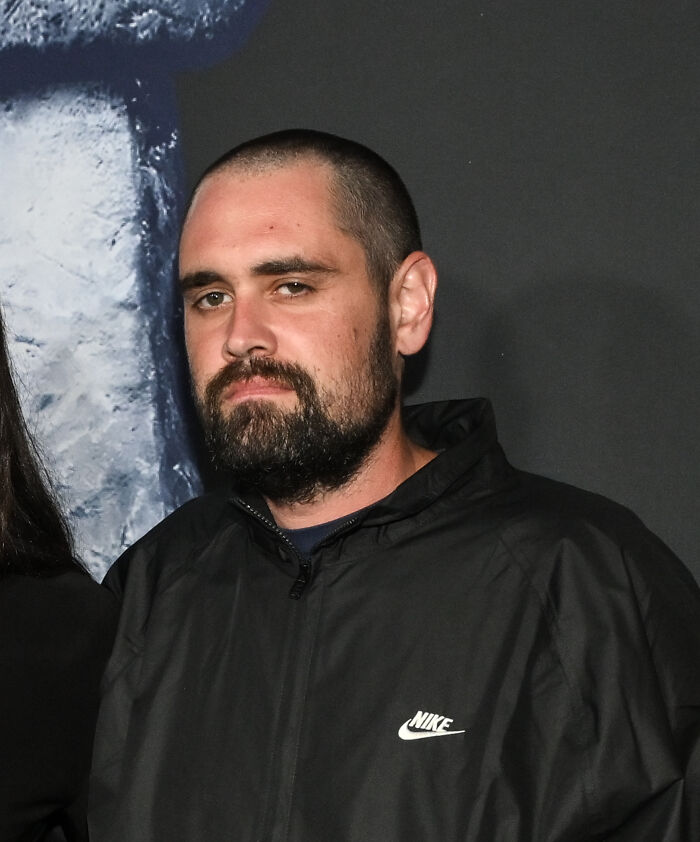 Man with short hair and beard wearing a black Nike jacket, portrait related to crimes that shocked the nation in 2025.