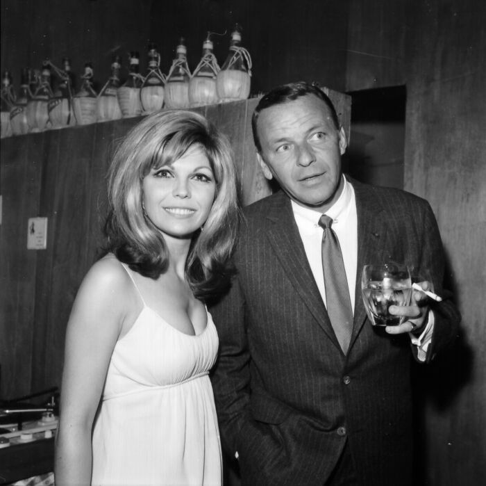 Nancy Sinatra with father Frank Sinatra in a vintage black and white photo, highlighting Nancy Sinatra Trump supporter remarks. Nancy Sinatra with father Frank Sinatra in a vintage black and white photo, highlighting Nancy Sinatra Trump supporter remarks.