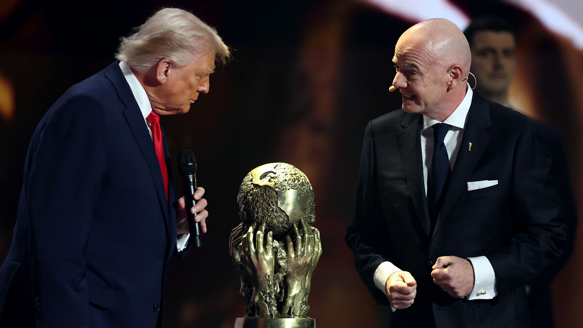 Donald Trump and Gianni Infantino near a golden peace prize trophy during a FIFA event, ethics complaint context.