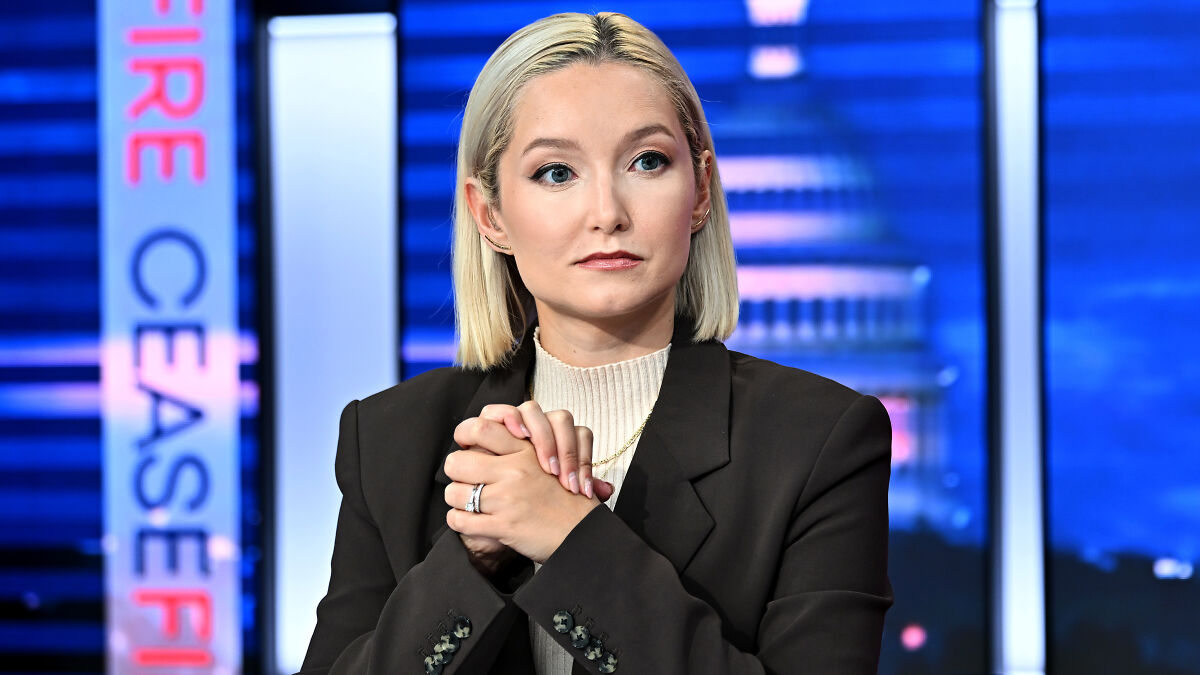 Reporter with blonde hair and black blazer in a studio setting discussing rising holiday costs and economic concerns.