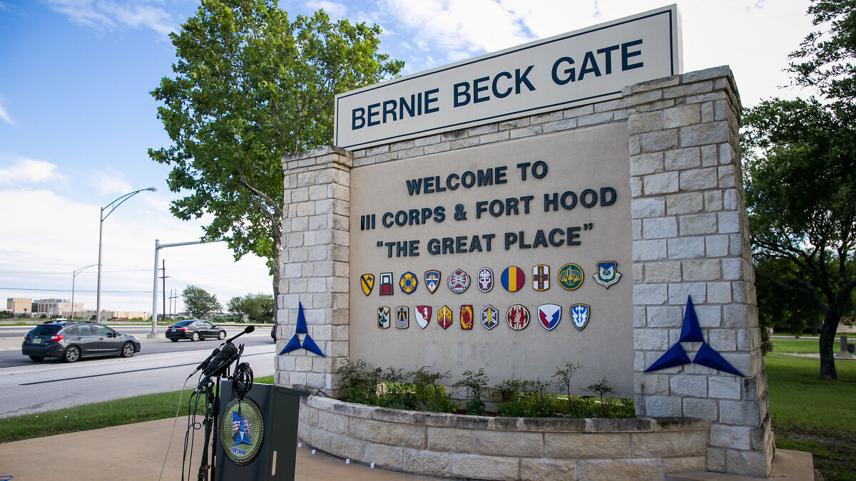 Bernie Beck Gate entrance at Fort Hood with microphones set up for a statement about army gynecologist accusations.