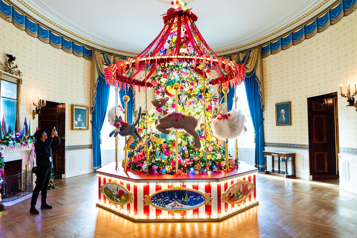 Festive carousel-style Christmas decorations with colorful ornaments and lights featured in Melania Trump’s 2025 holiday display.