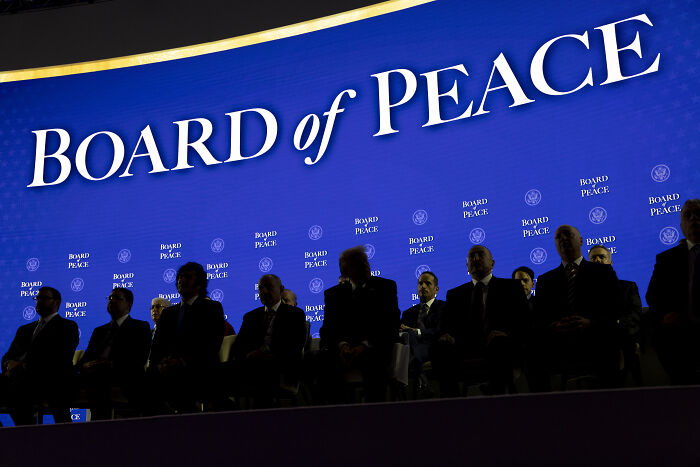 Group of world leaders seated in front of a large Board of Peace sign amid tension after Trump’s unhinged tirade. Group of world leaders seated in front of a large Board of Peace sign amid tension after Trump’s unhinged tirade.