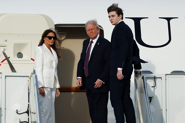 Melania Trump with Donald Trump and Barron Trump boarding a plane, highlighting parenting Barron at 19 as a nonstop job. Melania Trump with Donald Trump and Barron Trump boarding a plane, highlighting parenting Barron at 19 as a nonstop job.