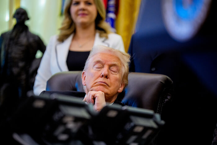 Former President Trump seated with eyes closed, highlighting health issues, compression socks, and makeup use. Former President Trump seated with eyes closed, highlighting health issues, compression socks, and makeup use.