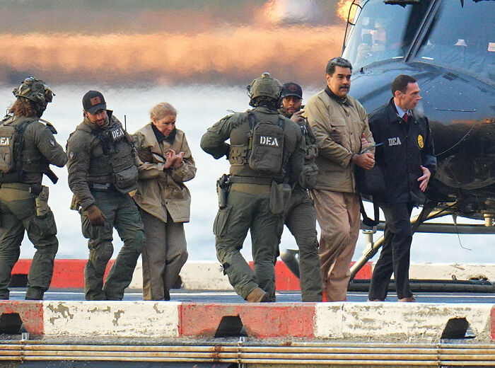 DEA agents escort Maduro and others near a helicopter as Volodymyr Zelenskyy&rsquo;s blunt take on U.S. capturing Maduro spreads.