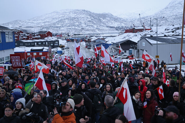 Crowd protesting in Greenland with flags and signs, capturing the viral urban yoga video hitting a nerve with the MAGA crowd. Crowd protesting in Greenland with flags and signs, capturing the viral urban yoga video hitting a nerve with the MAGA crowd.