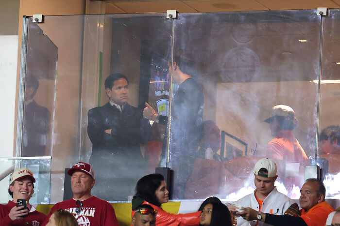 Crowd reaction with boos captured during Trump&rsquo;s appearance at the national anthem in CFP final stadium setting.