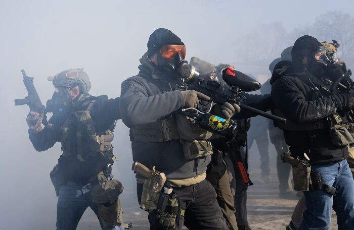 Group of armed tactical operators wearing protective gear and masks, representing 2nd Amendment and NRA themes in action. Group of armed tactical operators wearing protective gear and masks, representing 2nd Amendment and NRA themes in action.