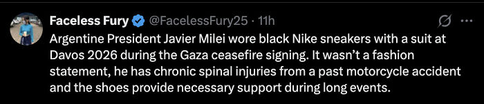 Argentine President Javier Milei wearing black Nike sneakers with a suit at Davos, standing out during a formal event. Argentine President Javier Milei wearing black Nike sneakers with a suit at Davos, standing out during a formal event.