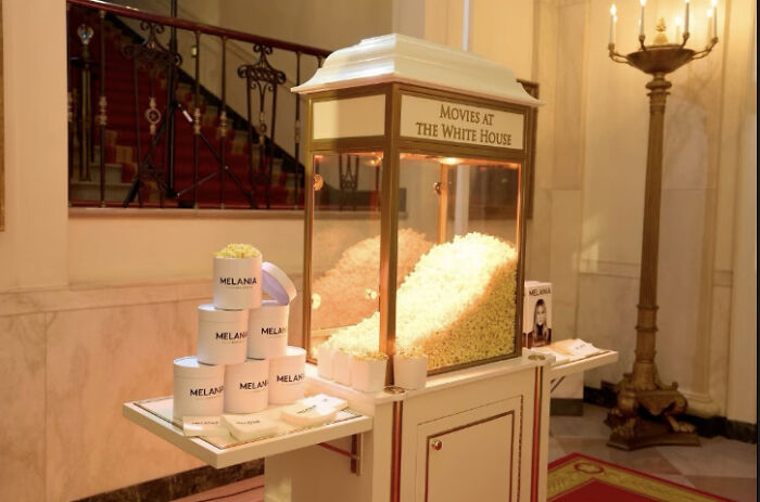 Popcorn machine and branded cups at Melania Trump gaudy documentary screening event inside the White House. Popcorn machine and branded cups at Melania Trump gaudy documentary screening event inside the White House.