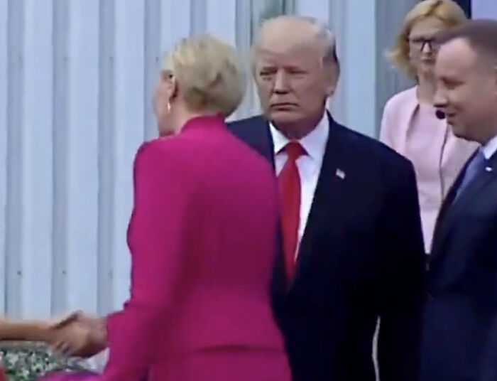 Donald Trump looking embarrassed as woman snubs greeting with a "perfect" reaction during a formal event. Donald Trump looking embarrassed as woman snubs greeting with a "perfect" reaction during a formal event.