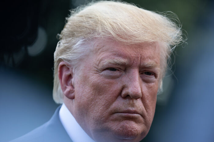 Close-up of a serious man with light hair, representing a key figure among MAGA stars linked to Mar-a-Lago in 2026.