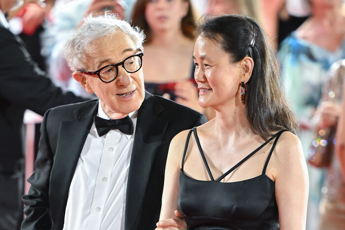 Woody Allen&rsquo;s wife smiling in black dress, attending event amid Epstein emails revealing #MeToo criticism and teen victim details.