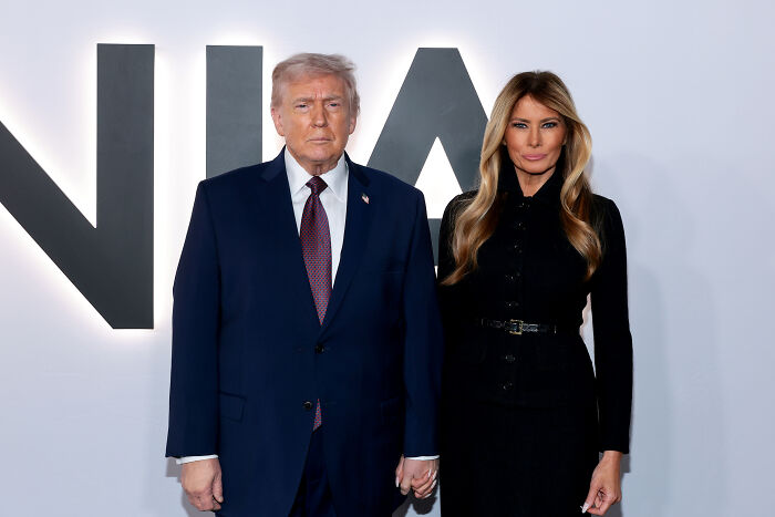 Donald Trump and Melania Trump posing together at an event promoting Melania Trump documentary box office success. Donald Trump and Melania Trump posing together at an event promoting Melania Trump documentary box office success.