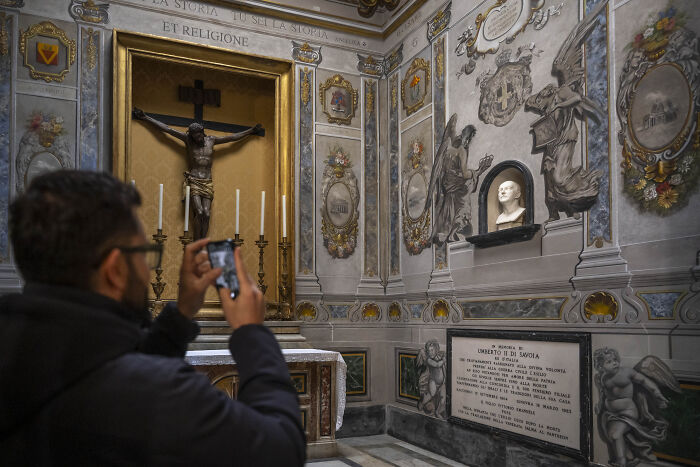 Man photographing restored church fresco in Rome where Trump ally&rsquo;s face was ordered scrubbed by Pope&rsquo;s diocese.