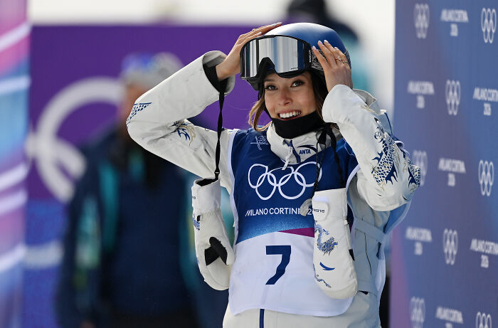 U.S. Olympian Hunter Hess smiling in ski gear during Milano Cortina 2026 Winter Olympics event.
